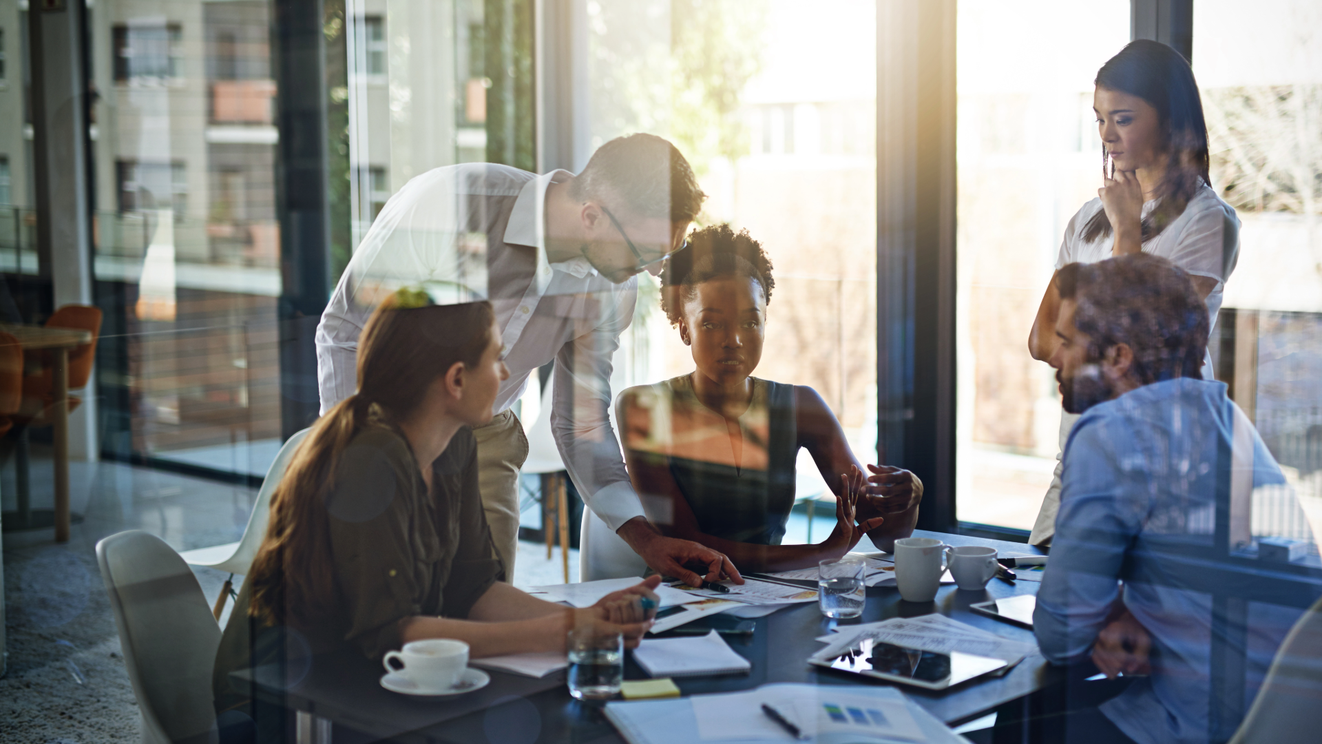 team meeting together in the office around a table